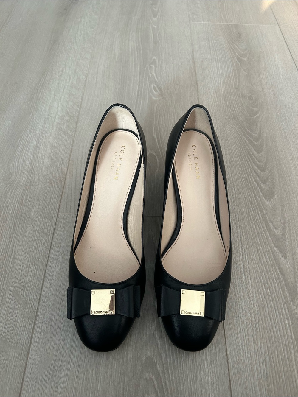 Cole Haan Black Leather Bow Pumps with Gold Plaque